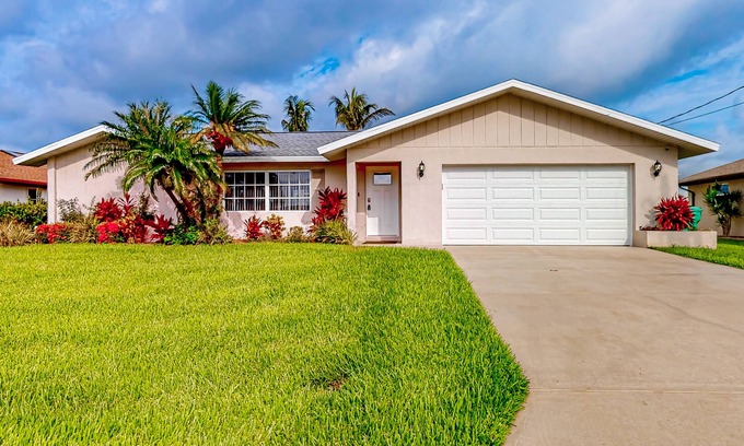 Gulf Cove House | Waterfront home with an enclosed pool, outdoor kitchen, and grill - dog-friendly