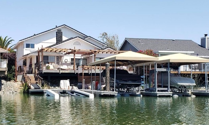 Discovery Bay House | Waterfront Home with large boat dock & boat rental and other water toys