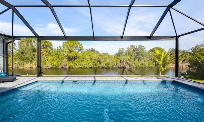 Port Charlotte House | Waterfront Key West Style Home with Heated Pool Located in South Gulf Cove