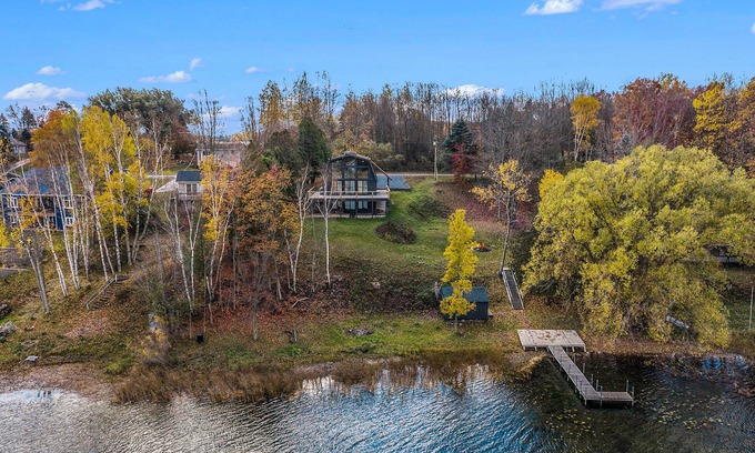 Scottville House | Waterfront Nordic Lodge on All Sports Lake, come with the whole family.