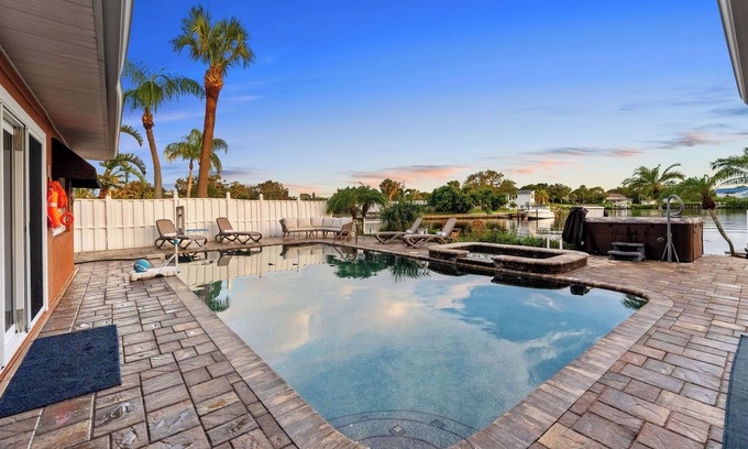Harbor Hills House | Waterfront Oasis w/Pool, Spa, Boat & Jet ski Dock, Game Room & Outdoor Kitchen