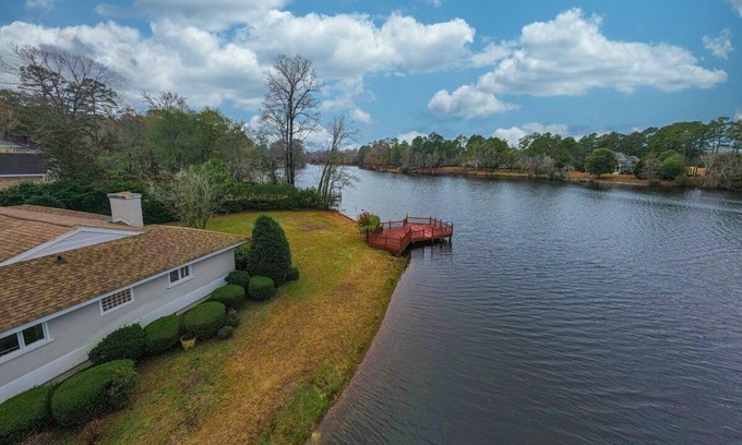Florence House | Waterfront Paradise with Golf Course Views