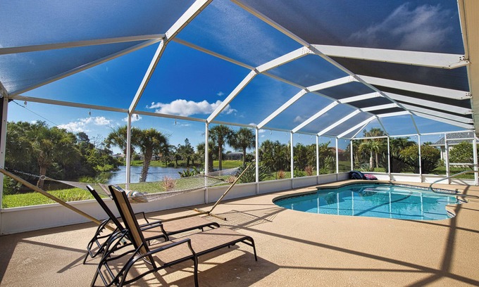 Pinehurst House | Waterfront private salt water pool house with lanai & incredible panoramic views