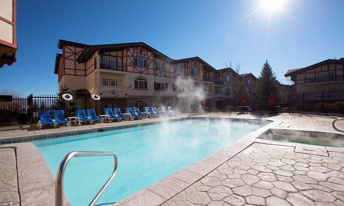 Midway House | Welcome to Swiss-charmed Mountain Retreat, a spacious 4-bedroom chalet perfect for your next getaway! Our chalet comfortably accommodates up to 14 guests with a total of 10 beds. Please note that the Murphy bed is located in a loft.