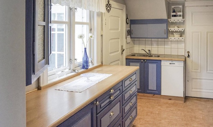 Flekkefjord House | Welcome to this charming vacation home situated on a natural plot that reaches down to the water.