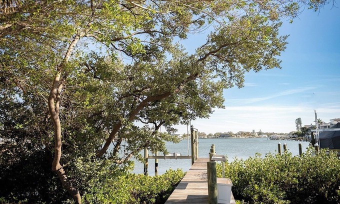 Belleair Shore House | Welcome to your private coastal getaway! This fully renovated 3-bedroom, 2-bath single family home is perfectly located on the Intracoastal Waterway—just a 2-minute walk to the sugar-white sands of Indian