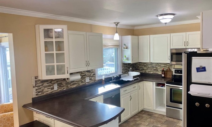 Fredericton House | Welcome to your home away from home located in a quiet family-friendly neighborhood