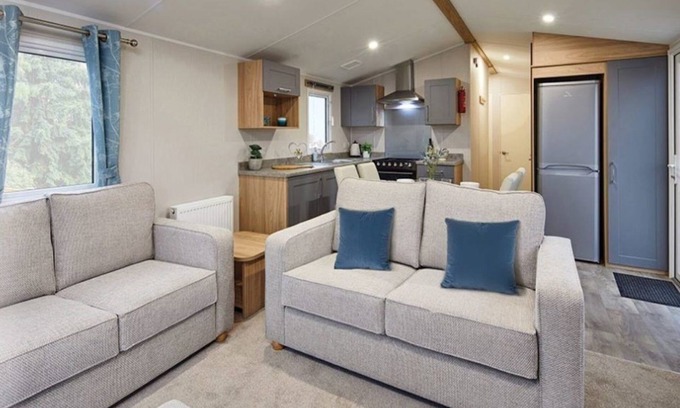 Dunbar House | Well appointed caravan with patio doors and decking.