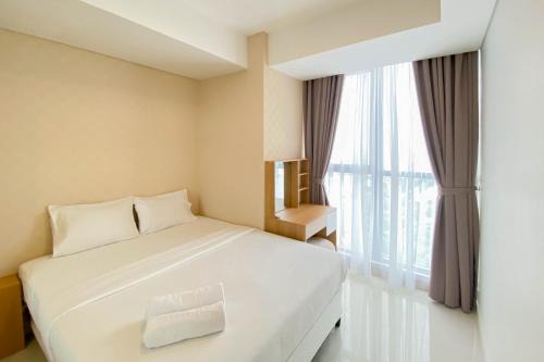 Pantai Indah Kapuk Apartment | Well Furnished and Comfortable 2BR Apartment Gold Coast By Travelio