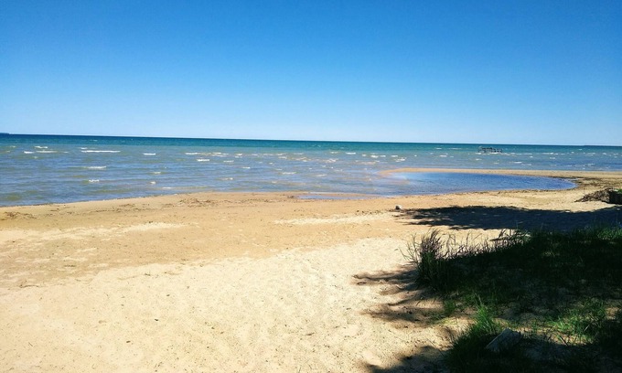 Caseville Cottage | 'Whispering Oaks' Cottage with Lake Access, Outdoor Fire Pit and More!