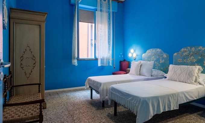 Ferrara Apartment | White Cross Square A Touch of Blue Apartment