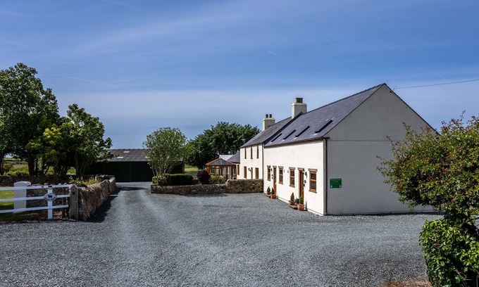 Llanfaelog House | Y Stabl: Pet-friendly cottage with stunning views