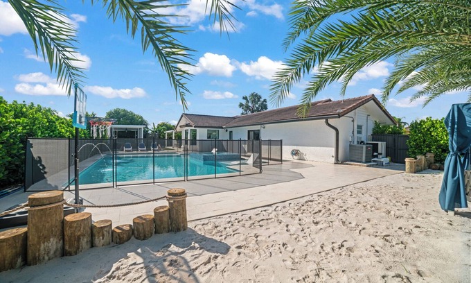 Ludlam Resort | You'll be captivated by the stunning 28 x 40 custom heated pool with jacuzzi
