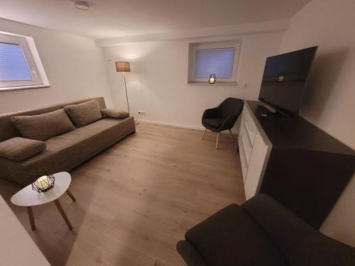 Garßen House | Zimmer im Souterrain mit eigenem Bad