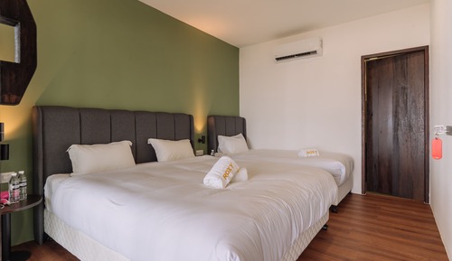 Longhouse Deluxe Triple Room