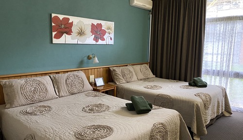 Room 11: Standard Two Queens with 50 inch Smart TV located on Ground Floor