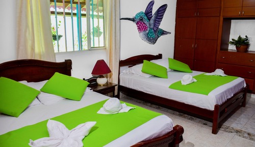 Room with 1 double bed and 3 single beds