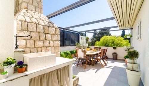 Three-Bedroom Apartment with Balcony and Garden View