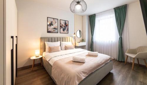 One-Bedroom Apartment with Balcony and City View