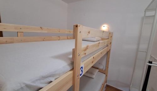 Single Bed in Dormitory Room