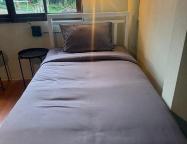 Single Bed in Dormitory Room