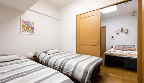 One-Bedroom Apartment with Balcony and City View