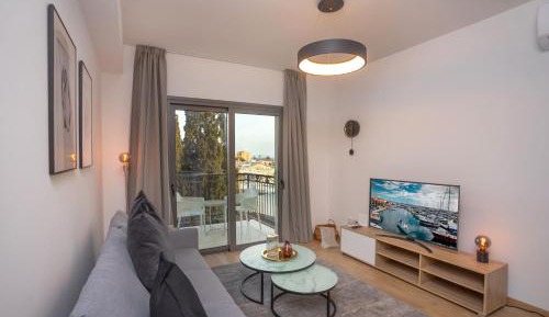One-Bedroom Apartment with Balcony and City View