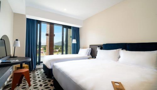 Standard King Room with King Bed and Single Bed - Balcony/Mountain View