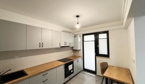 One-Bedroom Apartment with Balcony and City View