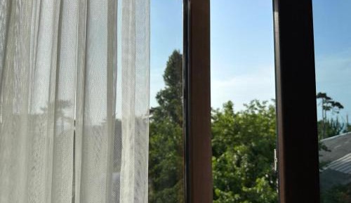 One-Bedroom Apartment with Balcony and City View