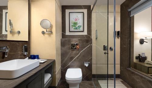 Deluxe King Room Complimentary Early Check in and Late Check Out (Subject to Availability),  15% Discount on F&B services, 10% Discount on Laundry service