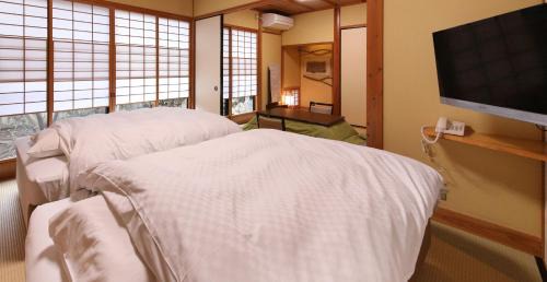 Twin Room with Tatami Area with Open-Air bath- New Building