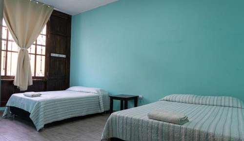 Twin Room with Two Double Beds with Shared Bathroom