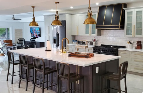 Caloosahatchee House | Custom Home with tile pool, boating dock and every comfort