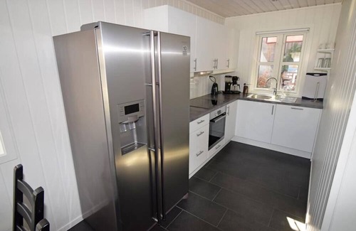 Lindesnes House | Holiday home 'Furuholmen Brygge 7', Furuholmen peninsula near Lindesnes, southern Norway, up to 7 people possible, e.g. 4 adults and 3-4 kids, 4 bedrooms, 2 shower-bathrooms, modern equipment, terrace and boat mooring in front of the house on the .