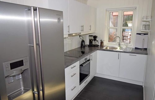 Lindesnes House | Holiday home 'Furuholmen Brygge 7', Furuholmen peninsula near Lindesnes, southern Norway, up to 7 people possible, e.g. 4 adults and 3-4 kids, 4 bedrooms, 2 shower-bathrooms, modern equipment, terrace and boat mooring in front of the house on the .