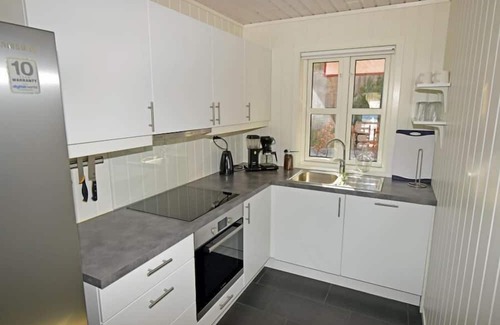 Lindesnes House | Holiday home 'Furuholmen Brygge 7', Furuholmen peninsula near Lindesnes, southern Norway, up to 7 people possible, e.g. 4 adults and 3-4 kids, 4 bedrooms, 2 shower-bathrooms, modern equipment, terrace and boat mooring in front of the house on the .