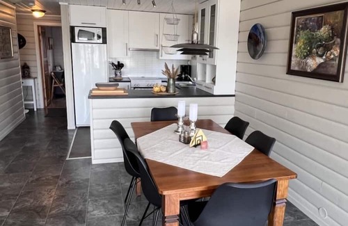 Lindesnes House | Holiday home Mona in Lussevika, new addition 2024, near Spangereid-Lindesnes, southern Norway, , max. 6 adults, own boat mooring, approx. 100 m² living space, 3 bedrooms, charming and tasteful furnishings, large veranda with fjord view, terrace f.