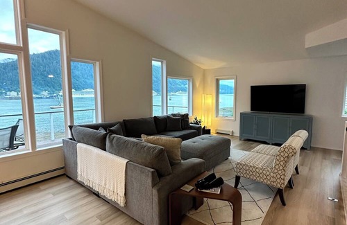 Juneau House | Spacious beachfront retreat with views of Gastineau Channel and downtown Juneau.