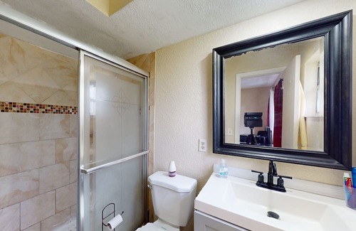 Casselberry House | Single-story home with community pool/tennis access, grill, patio, AC, & W/D