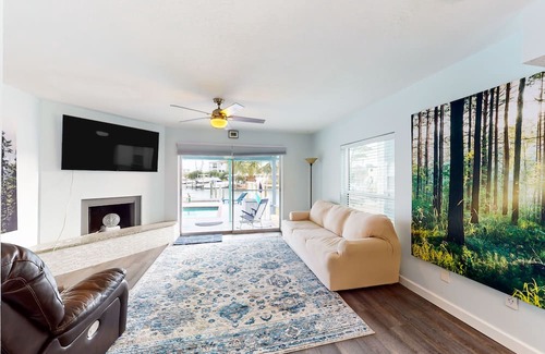 Capri Isle House | Renovated, waterfront townhome with pool & dock - walk to the beach