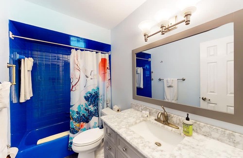 Capri Isle House | Renovated, waterfront townhome with pool & dock - walk to the beach