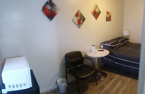 Savage House | Affordable cozy room meets unbeatable convenience.