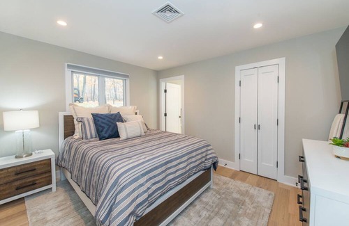 Sparta Township House | Aspen-style lakefront retreat house with hot tub, game room