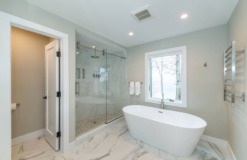 Sparta Township House | Aspen-style lakefront retreat house with hot tub, game room