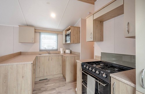 Sandyhills House | This spacious 2 bedroom caravan sleeps 4 people in one double and one twin bedroom.