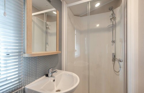 Sandyhills House | This spacious 2 bedroom caravan sleeps 4 people in one double and one twin bedroom.