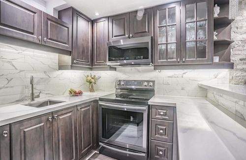 Markham House | Charming basement retreat awaits you!