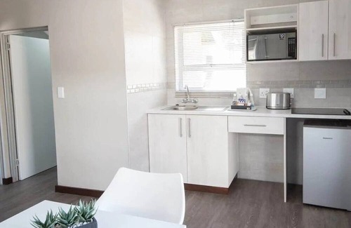 Windhoek House | Explore Avis Dam Nature Reserve! Onsite Pools, 2 Chalets w/ Kitchenette & Patio!