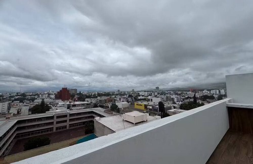 San Luis Potosi Apartment | Carranza Views! Heated Pool, KingBed & WorkSpace